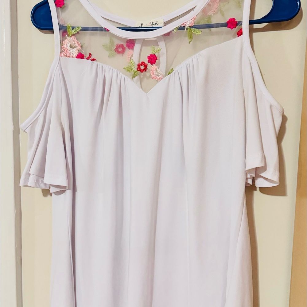 White elegant off-shoulder top. Elegant embroidery.